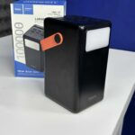 Hoco MMJ20 22.5W 100000mAh Power Bank showing the digital display and LED floodlight.