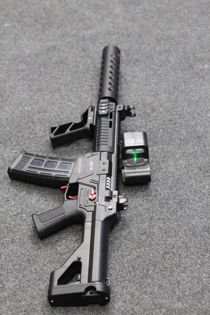 Black Tactical HD747A electric gel blaster featuring an optic sight, angled foregrip, and barrel shroud.