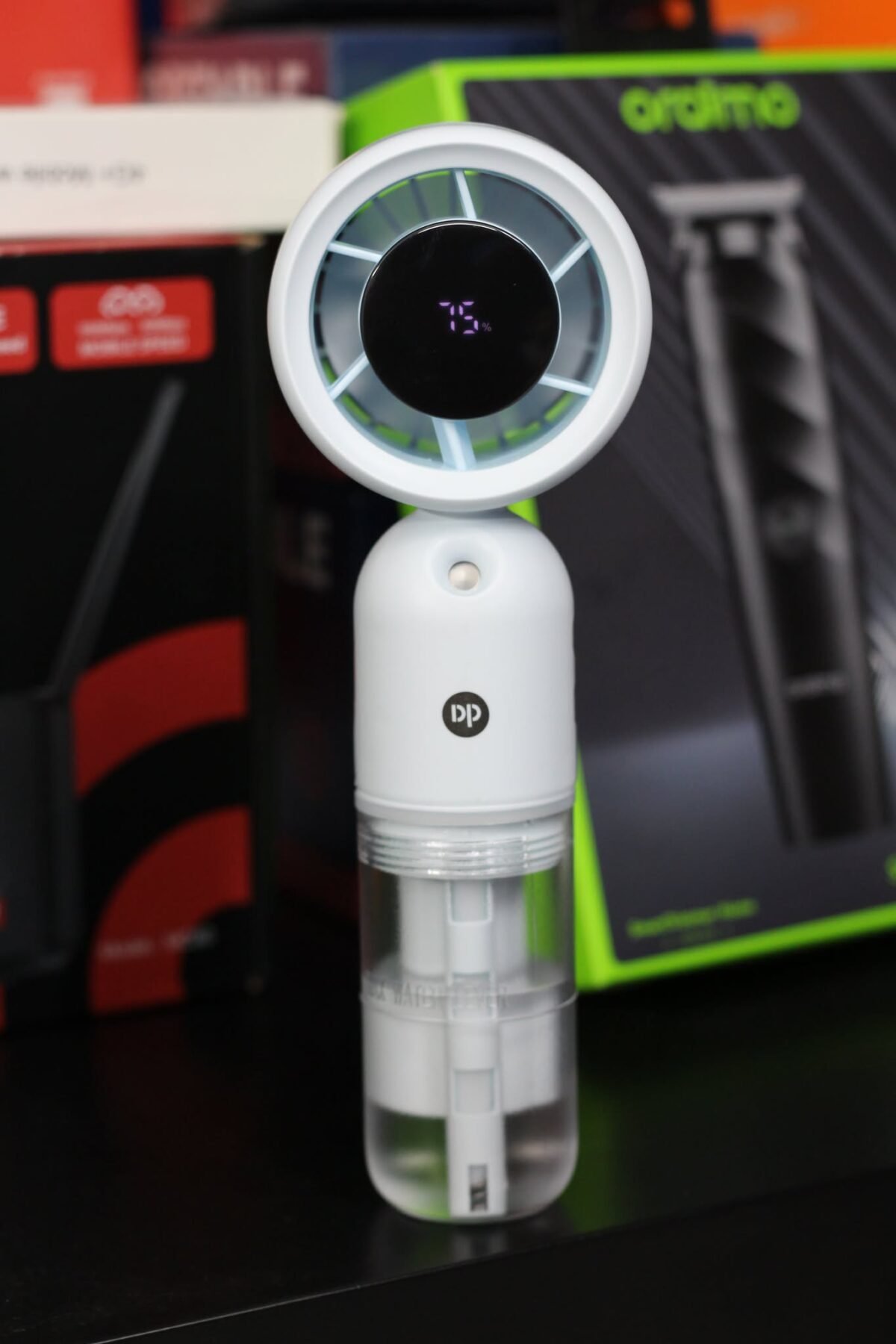 DP 7645 Turbo Mist Spray Handheld Fan showing its misting nozzle and ergonomic handle.