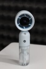 DP 7645 Turbo Mist Spray Handheld Fan showing its misting nozzle and ergonomic handle.