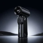Hoco HX68 Flujo Ultra High Speed Violent Turbo Jet Fan Black showing a tactical pocket-sized handheld mini air duster turbo blower with an industrial matte black metal finish, circular front wind nozzle, rear air intake grille, and a step-less speed roller wheel button layout view