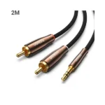 UGREEN 80847 auxiliary stereo adapter cable displaying its gold-plated 3.5mm jack plug and dual color-coded RCA male connectors with luxury copper case shells and a 2-meter black nylon braided wire pattern
