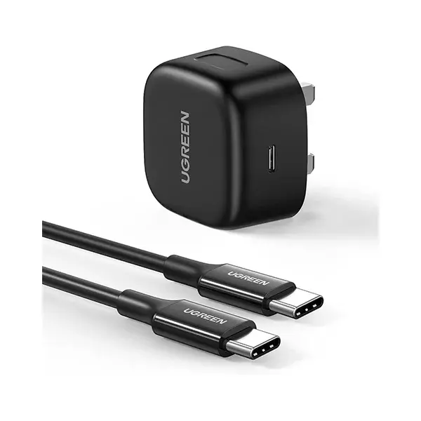 UGREEN 50577 20W PD Fast Charger Black UK 3 pin power brick next to its included high durability USB Type-C charging cable resting on a seamless white background