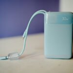 Baseus Enerfill FC11 30W 20000mAh Power Bank Galaxy Blue showing a premium rectangular portable external battery pack with an integrated smart digital LED display, two built-in storage slots for the Type-C and Lightning fast-charging cords, and a modern smooth galaxy blue exterior finish layout view
