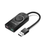 UGREEN 40964 USB external stereo sound card adapter in a sleek black finish featuring a 15cm flexible cable connection, a USB-A male input plug, and dedicated green headphone and pink microphone 3.5mm auxiliary output ports