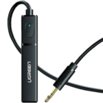 UGREEN 40761 USB powered wireless Bluetooth 5.0 audio transmitter device in a sleek black finish showcasing an attached 3.5mm male auxiliary connection cable line alongside a standard USB-A power interface plug