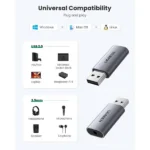 UGREEN 80864 desktop multi-port USB external stereo sound card adapter in a dark matte finish featuring a central mechanical volume adjustment knob, separate microphone and audio mute buttons with LED indicators, three 3.5mm auxiliary jacks, and a 1-meter connecting cable