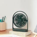 JISULIFE FA19A green color USB portable rechargeable desktop fan with adjustable tilt head flat base single power control button and Type-C input charging port front view turn on