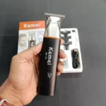 Kemei KM-779 professional rechargeable cordless hair and beard trimmer with attachment combs and charging cable