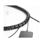 UGREEN 30820 Cable Organizer Tube showing a 5-meter long flexible spiral black cable sleeve wrap with a 25mm diameter holding thick computer power cords neatly behind an office desk workspace view