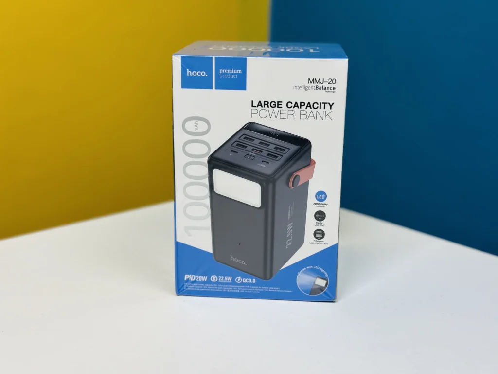 Hoco MMJ-20 large capacity power bank 100000mAh 22.5W fast charging with digital display smart screen and integrated bright camping LED light front view charcoal black color
