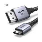 UGREEN 15514 Ultra High-Speed 8K Mini HDMI to HDMI 1m Cable with a black nylon braided jacket, aluminum alloy head, and mini HDMI connector pins