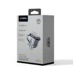 UGREEN 65826 65W GaN Fast Charger with Retractable Cable showing its compact circular design layout, smoothly extending built-in Type-C cable, additional charging ports, and premium travel-ready matte finish on a clean white background