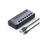 UGREEN 90307 CM481 powered 7-port USB-C to USB 3.0 hub showing the external DC 12V power input and individual toggle switches