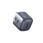 UGREEN 15540 Nexode 35W 2-Port GaN Fast Charger UK compact wall adapter showing its dual Type-C interface ports, standard UK three pin layout, and premium space gray fireproof exterior finish on a clean white background