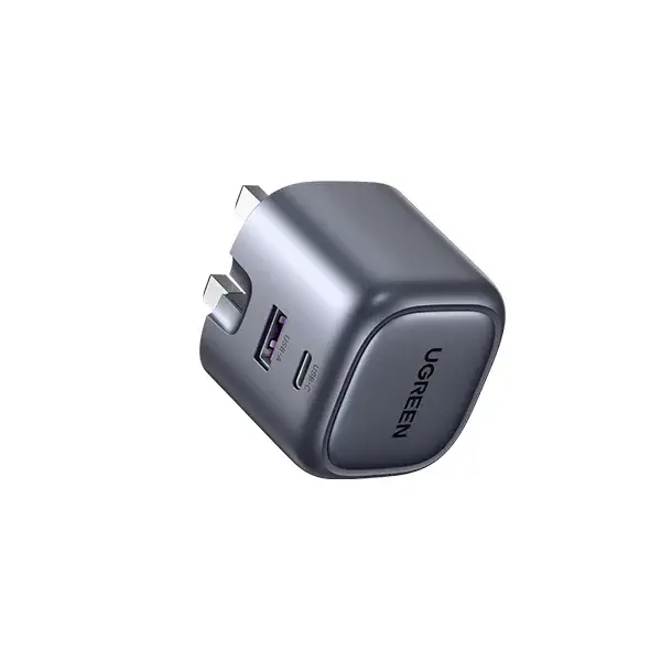 UGREEN 15540 Nexode 35W 2-Port GaN Fast Charger UK compact wall adapter showing its dual Type-C interface ports, standard UK three pin layout, and premium space gray fireproof exterior finish on a clean white background