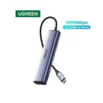 UGREEN 60600 USB-C Hub premium high capacity heavy duty 4-in-1 portable 1000Mbps network fast charging laptop docking station block showing clean Space Gray aluminum minimalist housing body layout with side terminal input port slots and attached braided type-c cord wire view]