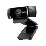 Logitech C922 Pro HD Stream webcam highlighting its sleek black rectangular casing premium glass central lens element and side mesh texture stereo microphone wings mounted on a monitor clip stand lines