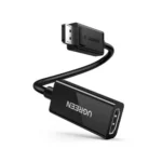 UGREEN 70694 DisplayPort Male to HDMI Female 25cm Adapter showing its gold-plated DisplayPort connector male end linked via a thick round black cable to a rectangular female HDMI adapter housing with the UGREEN logo printed on the shell matrix