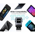 UGREEN 45514B Uno 100W 4-Port GaN Fast Charger US showing its futuristic space grey robot figurine body, animated pixel emoji LED face screen, and top multi-port array on a clean white background