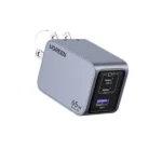UGREEN 25870 Nexode Pro 65W 3-Port GaN Fast Charger Set US showing its compact dark grey charger housing, two USB-C ports, one USB-A port, foldable US prongs, and the included premium black Type-C charging cable on a clean white background