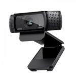 Logitech C920 Pro HD Pro webcam highlighting its professional matte black wide rectangular design central glass autofocus lens ring element and side textured stereo microphone grilles on a monitor mount lines