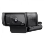 Logitech C920 Pro HD Pro webcam highlighting its professional matte black wide rectangular design central glass autofocus lens ring element and side textured stereo microphone grilles on a monitor mount lines