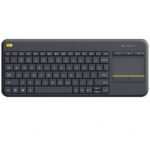 Logitech K400 Plus all-in-one wireless HTPC media keyboard in a premium matte dark grey finish showcasing an integrated 3.5-inch multi-touch pad with yellow accents on its media shortcut keys and left click button