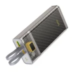 Hoco J104 Discovery Edition 22.5W 10000mAh Power Bank in transparent grey showing its internal circuit layout, built-in Type-C and Lightning cables clipped securely to the back, and a glossy top LED screen tracking its exact power percentage