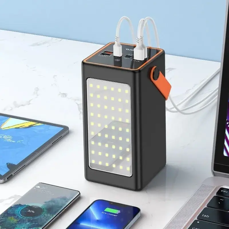 product_10669_main Hoco J107 Super 22.5W 90000mAh Fully Compatible Power Banks displayed in black and white retail boxes highlighting their massive front panel LED light boards, bright orange leather carry handles, top digital power meters, and extensive port configurations