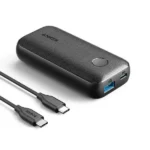 Anker PowerCore 10000 PD Redux Power Bank Model A1246011 in premium textured dark grey showing its circular power button, a high-speed blue PowerIQ USB-A port, and a Power Delivery Type-C input/output port