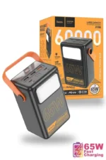 HOCO J110A 60000mAh Power Bank premium high capacity heavy duty 65W laptop portable power station brick retail box packaging layout in orange and white showing dark gray vertical body block with a large integrated rectangular white led lamp panel orange silicone carry handle strap and top multi-port array view]