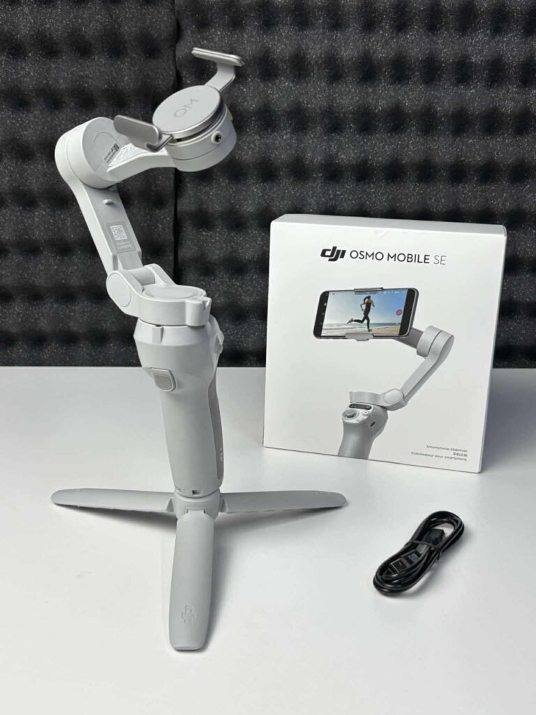 DJI Osmo Mobile SE Gimbal showing its foldable design and magnetic smartphone clamp.