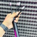 HOCO HP60 Electric Toothbrush showing its sleek waterproof body and interchangeable brush heads.